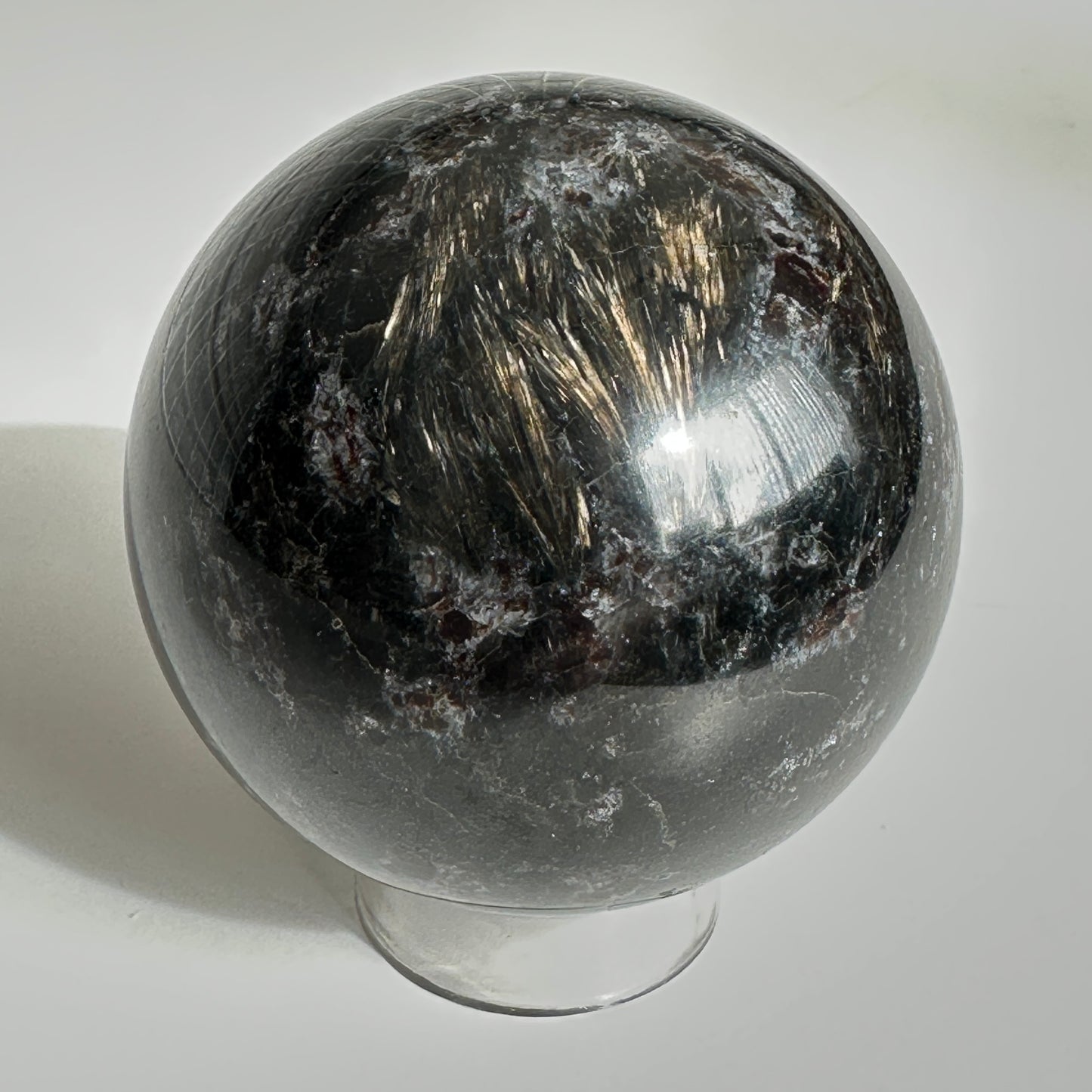 Radiant 6.80cm Astrophyllite and Garnet Sphere from India