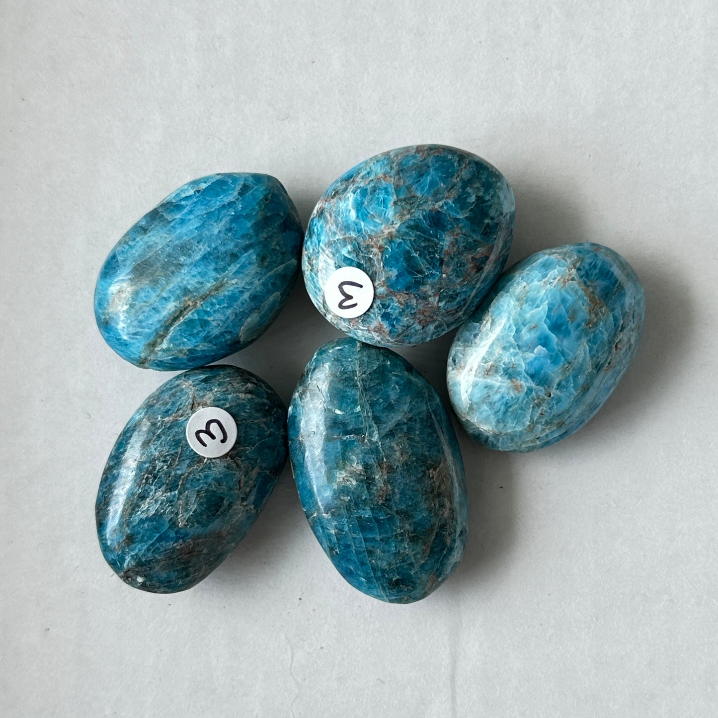 Small Tumbled Teal Blue Apatite Palm Stone from Brazil